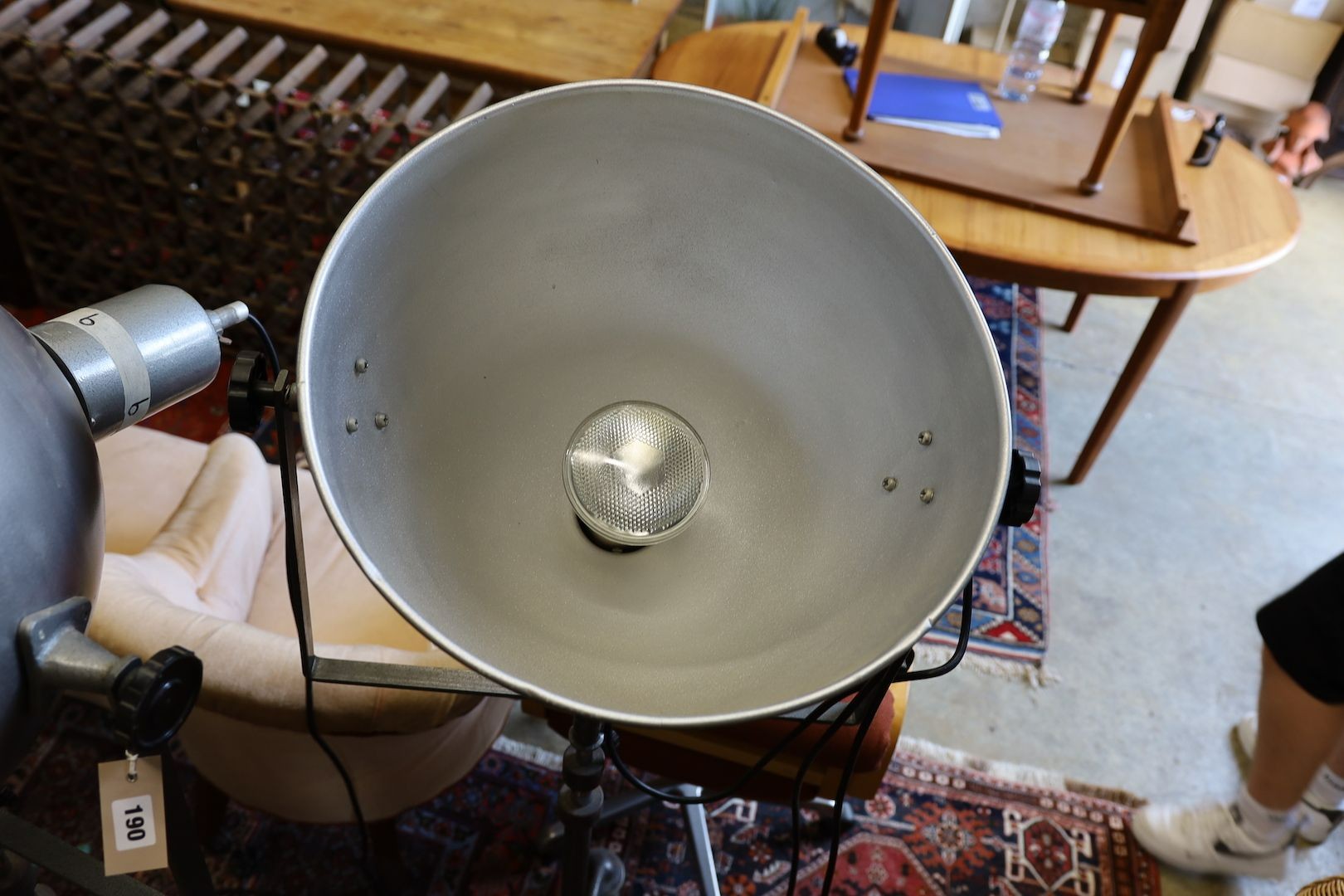 A pair of industrial style theatre lights on telescopic stands (reputedly from The Strand, London), shade diameter 48cm